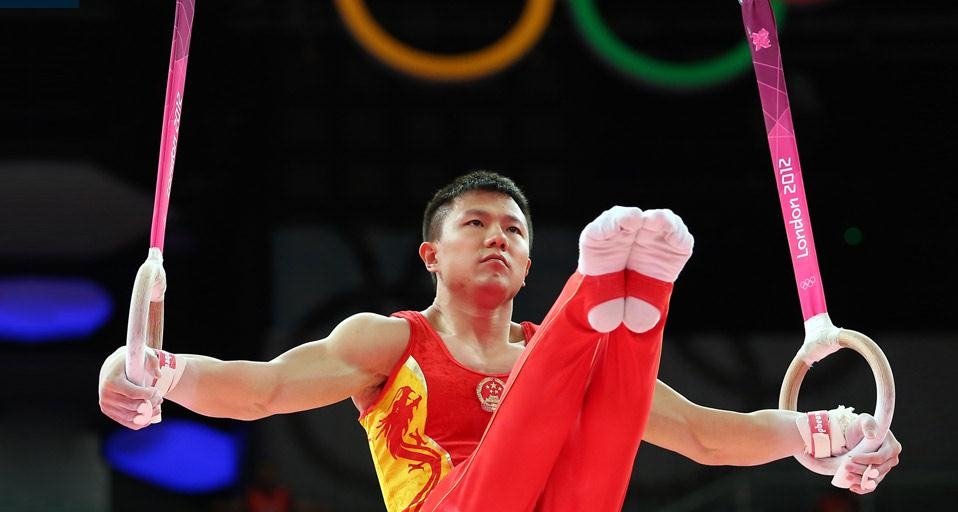 2012年7月30日伦敦北格林威治体育馆内,男子团体体操决赛中的陈一冰(© Ronald Martinez/Getty Images) ©) - 2012/07/30 2012年7月30日伦敦北格林威治体育馆内,男子团体体操决赛中的陈一冰(© Ronald Martinez/Getty Images) ©) - 2012/07/30